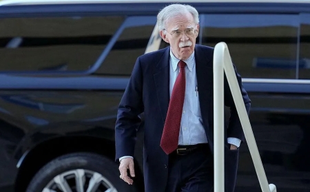 Bolton surrenders to face charges of sharing classified information