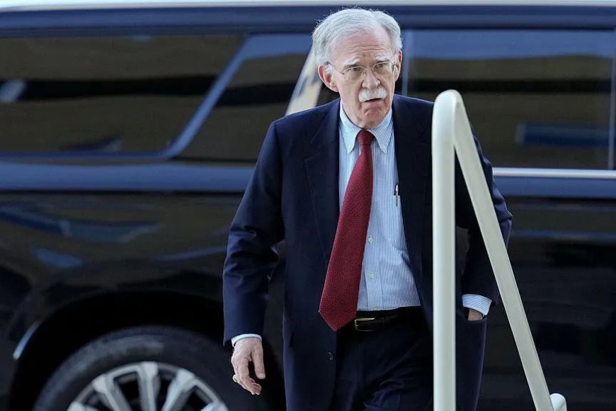 Bolton surrenders to face charges of sharing classified information